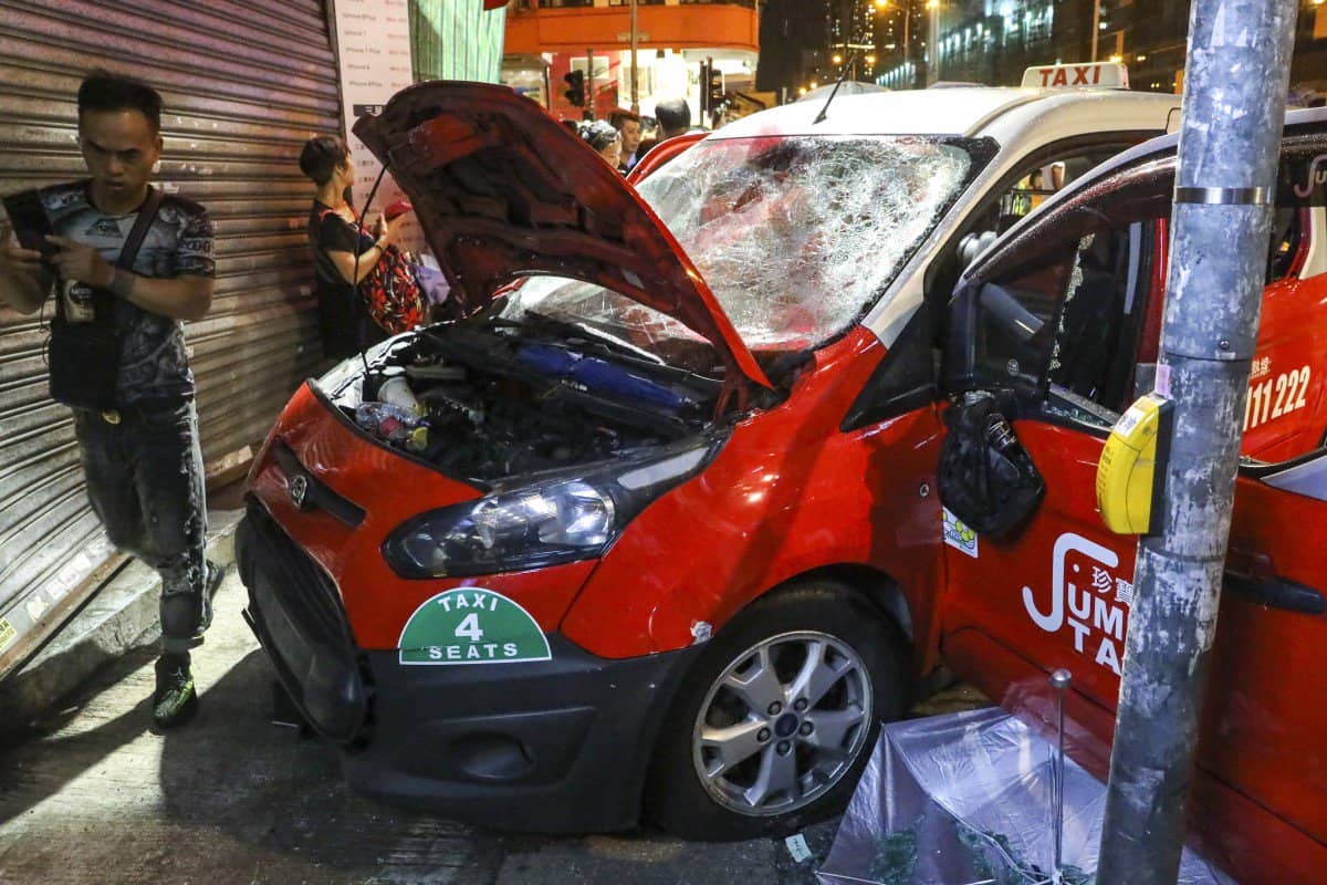 Taxi driver beaten by a mob after slamming into a crowd of protestors (Hong Kong)