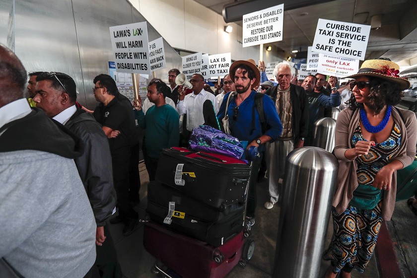 Taxi drivers protest against curbside pickup ban in LAX