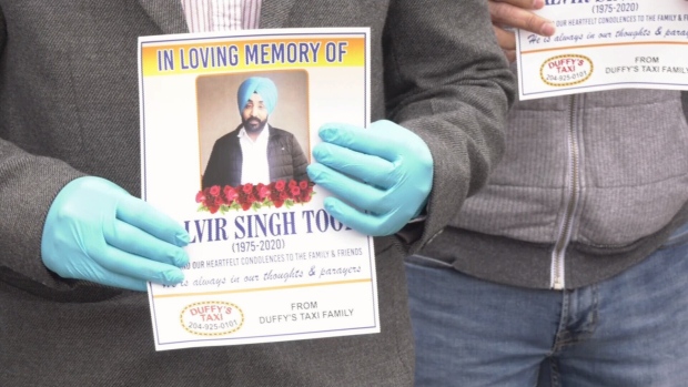 Taxi drivers rally in memory of man killed on the job