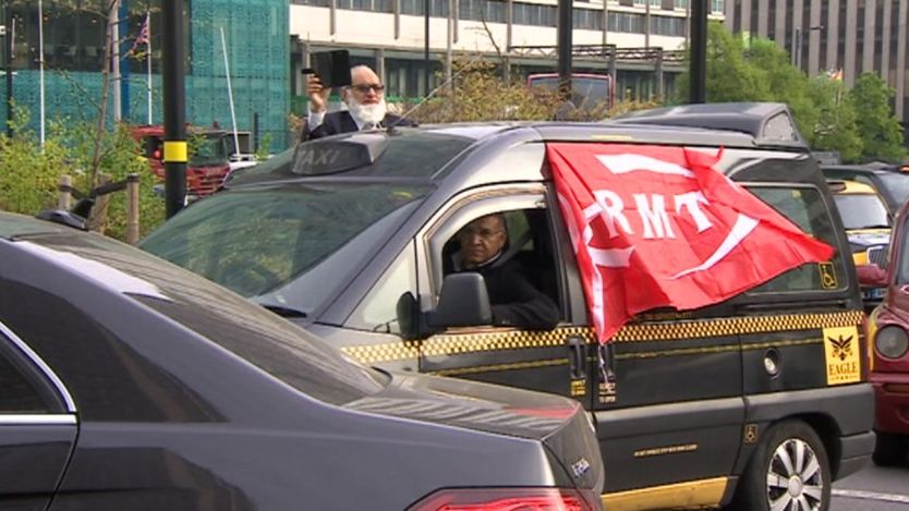 Taxi driver flying RMT flag in Birmingham traffic